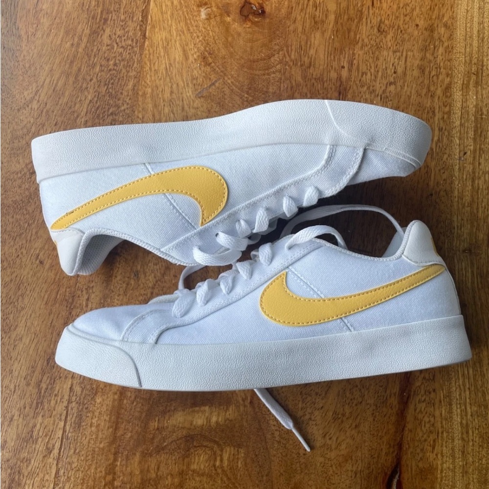 Nike White Low-Top Sneakers with Yellow Swoosh